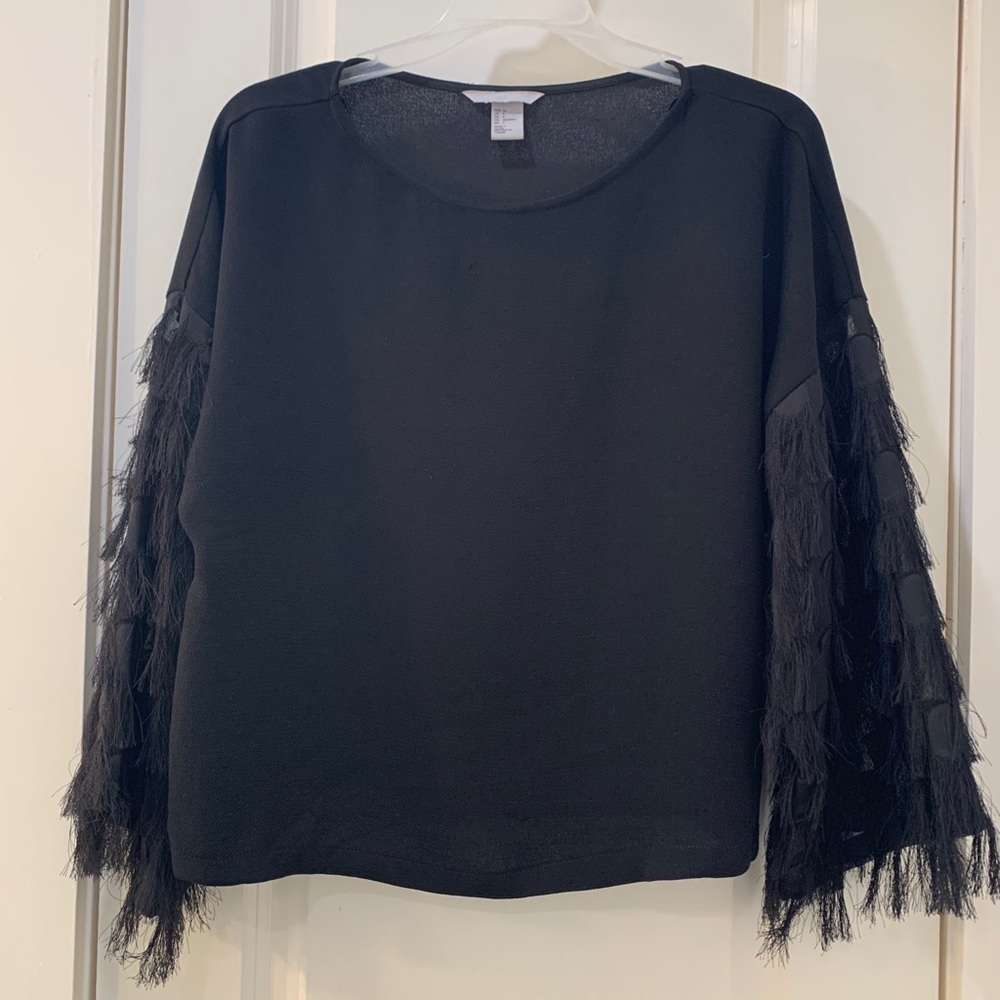 Black top with fringed sleeves